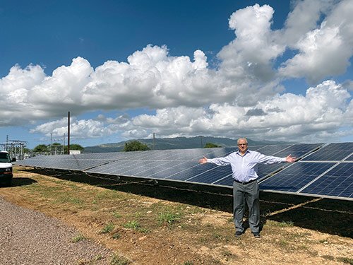 At the Hawaiian blessing and dedication ceremony for the West Loch Solar Project. The PUF team marvels at the large size of the solar project.